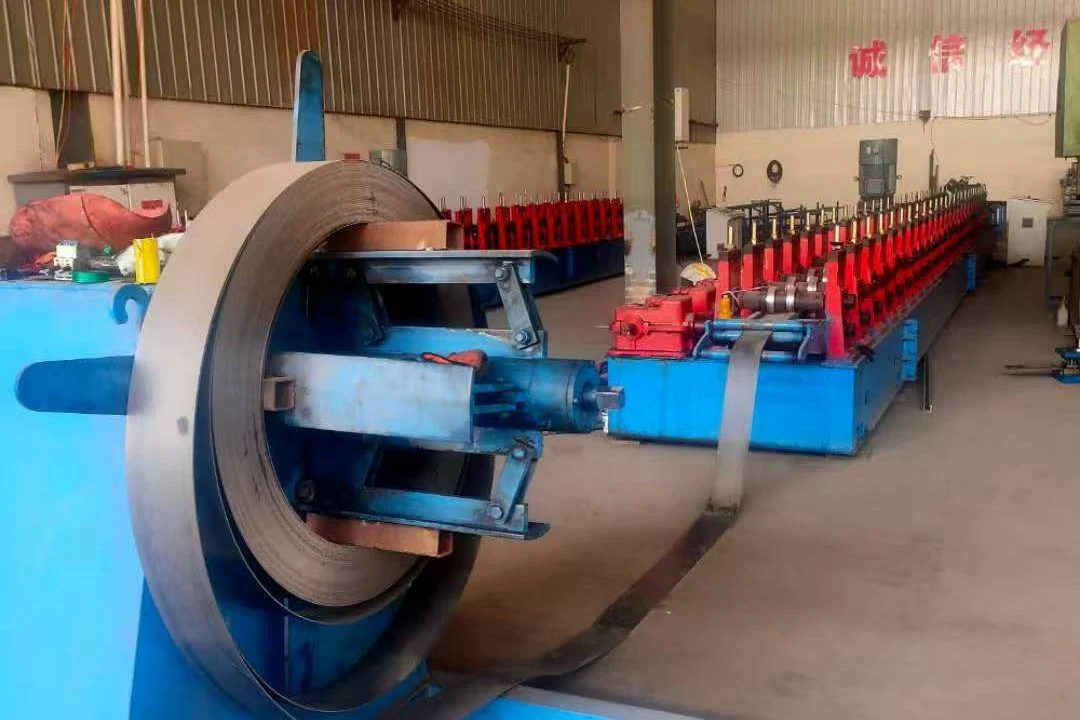 Roll-forming line with a steel coil on the decoiler feeding the forming stands