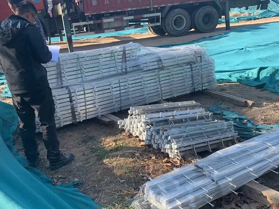 Packed and wrapped galvanised profile bundles prepared for delivery